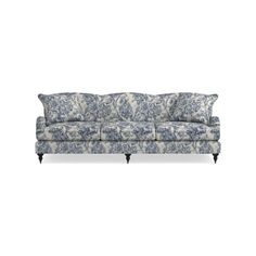 a blue and white couch with pillows on it