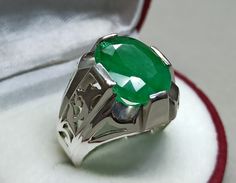 Rich Green Emerald Sterling Silver 925 Handmade Ring Product Type: Ring Ring Size: 5 US, 6 US, 7 US, 8 US, 9 US, 10 US, 11 US, 12 US, 13 US, 14 US, 15 US, 16 US Stone Type: Emerald, Zamurd Metal Type: Sterling Silver 925 Main Stone: Emerald Main Stone Color: Green Handmade: Yes, Artisan Ring Type: High Quality Heated & Treated (Lab Created) This Sterling Silver Ring is a perfect gift for men and women. The ring showcases an elegant design with unique Emerald stone. Get it for your loved one, or treatment yourself for a classic timeless style. All orders come in a special gift box. Please contact us if you don't see your size. We will do our best to obtain it from our warehouse or resize when possible. Customer Policy: ● Your satisfaction is our priority. ● We guarantee you our products qua Gemstones Rings, Green Emerald Ring, Artisan Rings, Mens Engagement, Engagement Rings For Men, Green Emerald, Types Of Rings, Emerald Ring, Silver Jewellery