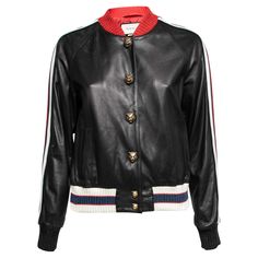 This Bomber jacket from the House of Gucci will help you sport a dapper style. It is designed using black leather, with Hollywood embroidery highlighting the back. It is embellished with gold-tone buttons and contrasting trims. This jacket accommodates two pockets. This Gucci jacket will surely be your favorite pick. Striped Leather Jacket, Embroidered Leather Jacket, Leather Flight Jacket, Gucci Jacket, Black Hollywood, Cropped Leather Jacket, Stripe Outfits, Embroidered Leather, Real Leather Jacket