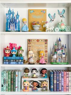 the shelves are filled with figurines and books