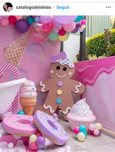 an ice cream parlor decorated with balloons and decorations