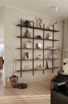 a living room filled with furniture and shelves