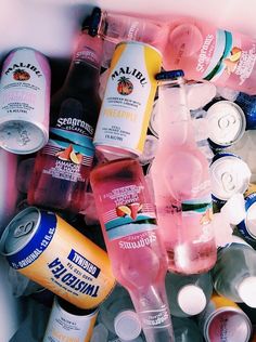 a cooler filled with lots of different types of drinks