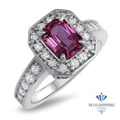 a pink tourmaline and diamond ring with white diamonds on the sides, set in 18k white gold