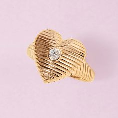 Carrying your heart on your fingers, literally. The solid gold textured heart ring is equally dreamy and bold. The diamond in the middle is the cherry on top of the piece, it adds that special glow. 14k solid gold Average diamond weight is 0.13cts Heart dimensions: 15 x 16mm Diamond Heart Jewelry, Hotline Bling, Geometric Diamond, St Valentin, Cherry On Top, Heart On, Gold Texture, Diamond Sizes, Heart Jewelry