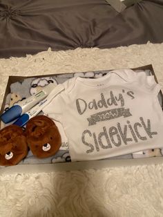 a baby's first birthday gift set in a box with teddy bears and t - shirts