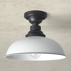 an overhead light fixture on the ceiling