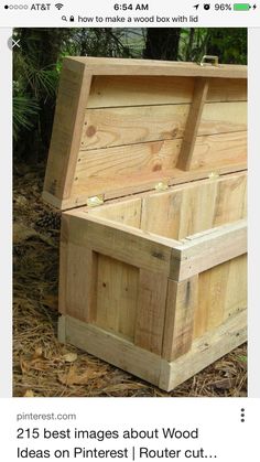 an empty wooden box sitting on the ground