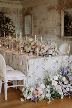 Bridgerton inspired wedding table setting with floral table cloth, pastel colour flowers, gold leaf cutlery, regal white chairs, pale taper candles in gold candlestick holders. Kamila Nowak Photography. Bridgerton Inspired Wedding, Pastel Wedding Decorations, Bridgerton Wedding, Regency Wedding, Floral Design Business, Regency Decor, Bridgerton Inspired, Dream Wedding Decorations, Wedding Tablescape