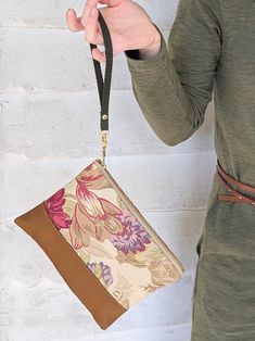 These sweetly old-fashioned rose prints will add a little romance to your busy days. Our new detachable cotton twill wristlet strap is included so you can use this as a clutch or wristlet. These purses are a perfect size for everyday essentials. You can fit a cell phone, wallet, lipstick and comb with ease. The sturdy brass zippers make them easy to use. 8.5" X 6" Designed and handmade at the Ash & Rose studio in Massachusetts Limited edition Hunting Shop, Rose Prints, Rose Purse, Work Wife, Red Champagne, Cell Phone Wallet, A Cell, Antique Roses, Free Gift Wrapping