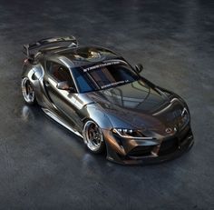 a silver sports car parked in a garage