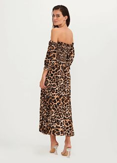 Looking for the perfect beach-to-street outfit? Look no further than our Jaguar Animal Print Dress, the ultimate in versatile style to match with your Brazilian Bikini Featuring a striking animal print design, our dress is perfect for any occasion, from a day at the beach to a night out on the town. The removable sleeves and elastic ruching add a touch of effortless chic to the design, while the lurex threads throughout the fabric add a touch of shimmer and shine. Crafted from high-quality mater Leopard Print Vacation Dresses, Leopard Print Maxi Dress For Beach, Leopard Print Summer Vacation Dresses, Spring Leopard Print Maxi Dress For Beach, Summer Vacation Leopard Print Dresses, Chic Tiger Print Summer Dress, Chic Summer Tiger Print Dress, Chic Summer Dress With Tiger Print, Casual Leopard Print Summer Dress