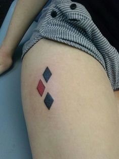 a person with a small tattoo on their thigh