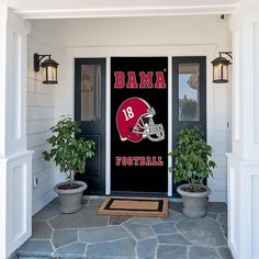 the front door to a house with two potted plants on each side and a sign that says, legenddray atlanta championships