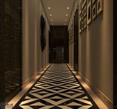 a long hallway with black and white tiles on the floor is lit by recessed lights