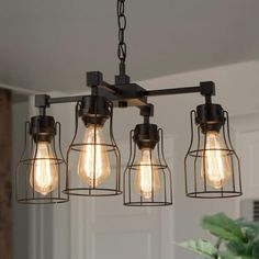 a light fixture with five lights hanging from it