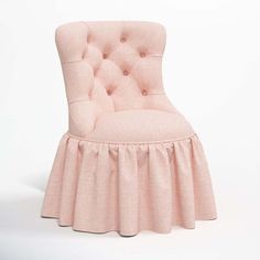 a pink chair with a ruffled skirt on it's seat and back, in front of a white background