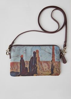 Monument Valley Navajo. Crafted from genuine leather and printed canvas, the VIDA Statement Clutch is a versatile standout accessory for any occasion. Audacity Press original.