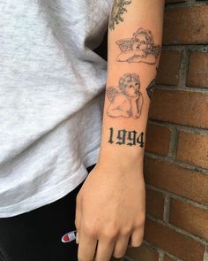 a person with a tattoo on their arm