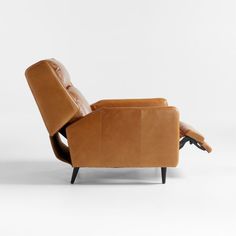 the reclining chair is made from brown leather