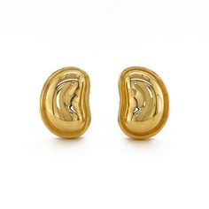 Designed with the unique sculpt of beans in mind, these polished 18k yellow gold earrings scintillate. The overall curve of the beans faces inward and are bezel set. Clip-backs attach the ears to the earrings, which measure 0.54 inches (width) by 0.77 inches (length). Bean Earrings, Yellow Gold Earrings, Yellow Gold Earring, Large Earrings, Bezel Setting, Clip On Earrings, Gold Earrings, Gold Rings, Jewelry Earrings