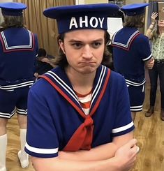 a man wearing a sailor's hat with the word ahoy on it