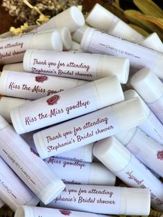 wedding favors are arranged in a basket on the table