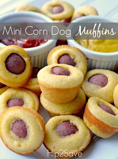 mini corn dog muffins with ketchup and mustard in the middle on a white plate