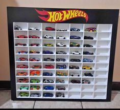 a display case filled with lots of toy cars