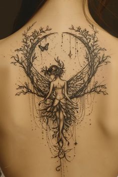 a woman's back with a tattoo on it