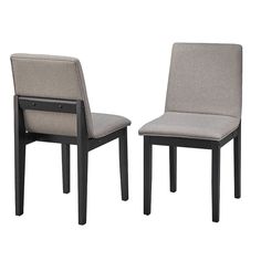 two gray chairs sitting next to each other