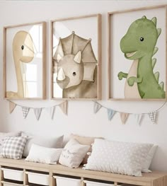 three framed pictures hang on the wall above a wooden bench with pillows and pillow cases