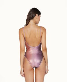 Our Violet Haze Scoop One-Piece Swimsuit is a fusion of luxury and allure. This exquisite design features a sophisticated mesh adorned with glimmering lurex shine woven throughout, set against a subtle nude base for a captivating sheer aesthetic. Ideal for the fashion-forward individual, this one-piece is a testament to glamour and elegance. Includes removable padding and shelf bra for support. Metallic Shimmer Beachwear Swimwear, Gold Shimmer Swimwear For Party, Elegant Pink Swimsuit, Elegant Pink Bodysuit For Swimming, Gold Shimmer Party Swimwear, Shimmer Beachwear Swimwear, Metallic Swimwear For Summer, Elegant Metallic Swimwear, Elegant Gold Bodysuit For Summer