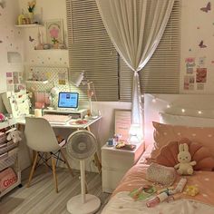 a small child's bedroom with pink and white decor