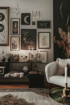 a living room filled with lots of pictures on the wall and candles in front of it