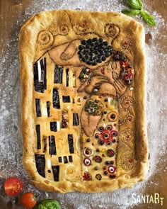 a pie with an image of a woman's face on it and other items surrounding it