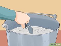 a person is stirring something in a pot