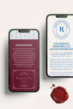 two cell phones are next to each other on a white surface with a wax seal