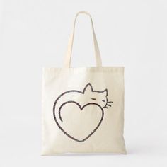 a white tote bag with a black cat on it's side and a heart drawn in the middle