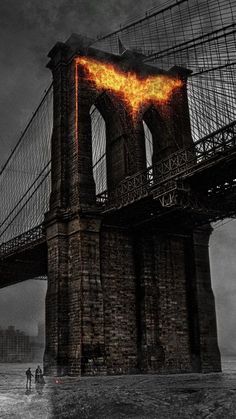 the dark knight rises batman poster is shown in front of a bridge with flames coming out of it