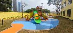 a colorful playground in the middle of a city