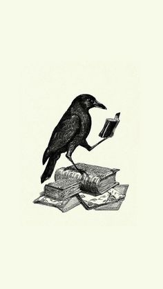 a black bird sitting on top of an open book next to a pile of books