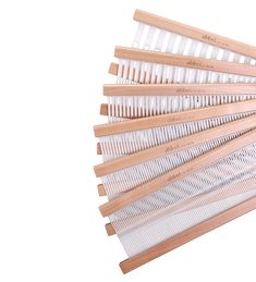 several wooden combs are stacked on top of each other