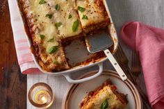 lasagna casserole on a plate with a serving utensil next to it