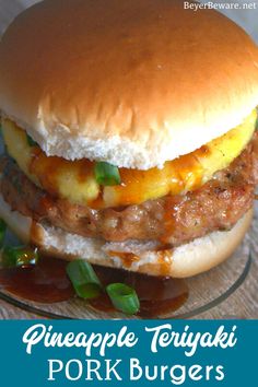 a cheeseburger with pineapple teriyaki pork burgers on a glass plate