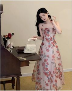 This dress is made of synthetic fiber and has a regular fit. It has a strapless neckline, an empire waistline, and a regular sleeve style. The dress is designed for summer wear and is intended for women aged 18-24. The dress is a Jielur brand and is made in China. Feminine Summer Chiffon Dress For Prom, Summer Chiffon Prom Dress With Sweetheart Neckline, Chic Summer Chiffon Prom Dress, Summer Prom Chiffon Dress With Sweetheart Neckline, Feminine Spring Chiffon Prom Dress, Pink Chiffon Summer Prom Dress, Feminine Spring Chiffon Dress For Prom, Pink Summer Prom Chiffon Dress, Summer Evening Strapless Sundress