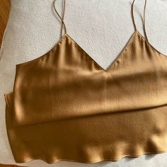 100% Silk V-Neck Cami In Copper. Size 40 - Fits Like A Medium. Originally Purchase From Etsy. Brand New And Unworn. Silk, Wedding, Party, Date, Evening, Copper, Bronze, Metallic Silk V-neck Top For Night Out, Trendy Gold V-neck Top, Silk V-neck Tank Top For Night Out, Spring Gold Silk Top, Gold Silk Top For Spring, Gold Silk V-neck Top, Gold Silk Tops For Spring, Gold V-neck Tank Top For Summer, Elegant Gold Camisole For Spring