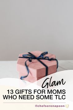 a pink gift box with the words glam gifts for moms who need some tlc