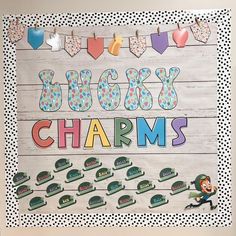 a bulletin board with the words boozy charms and bunting flags on it in front of a polka dot background