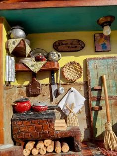 a doll house kitchen with various items on the counter